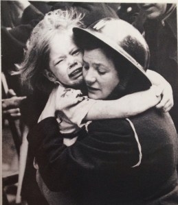 Image IWM London  A warden holds a terrified child who had just been rescued by a fireman from a house hit by a V1 flying bomb in southern England June 1944