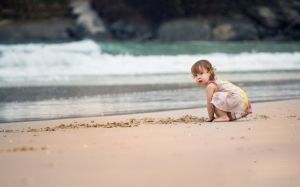 Girl on a beach "Wallpaperup"