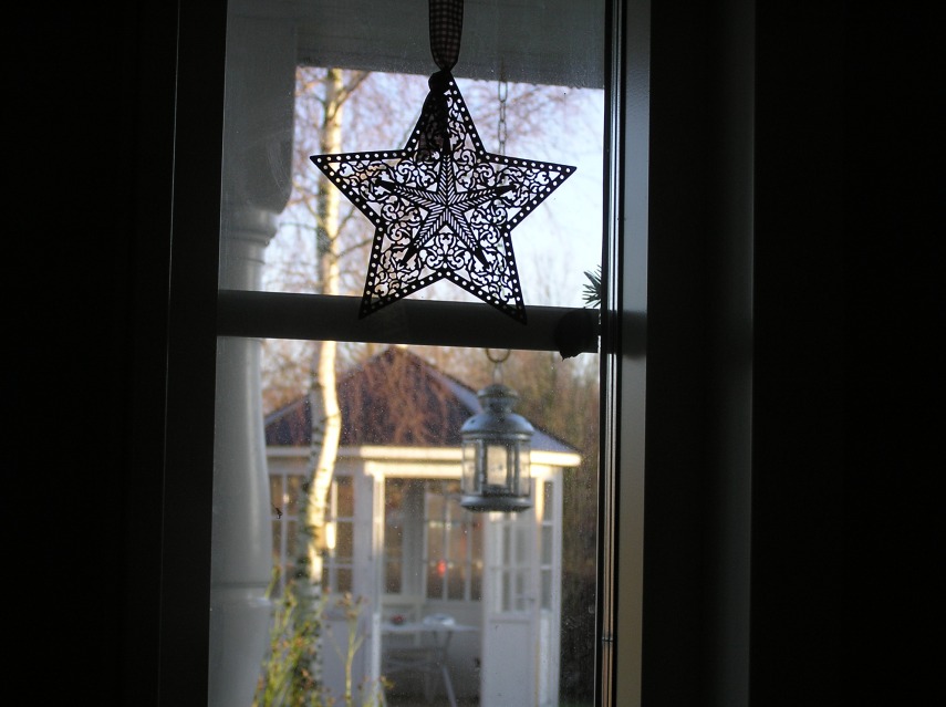 A bronze Christmas star in my small window