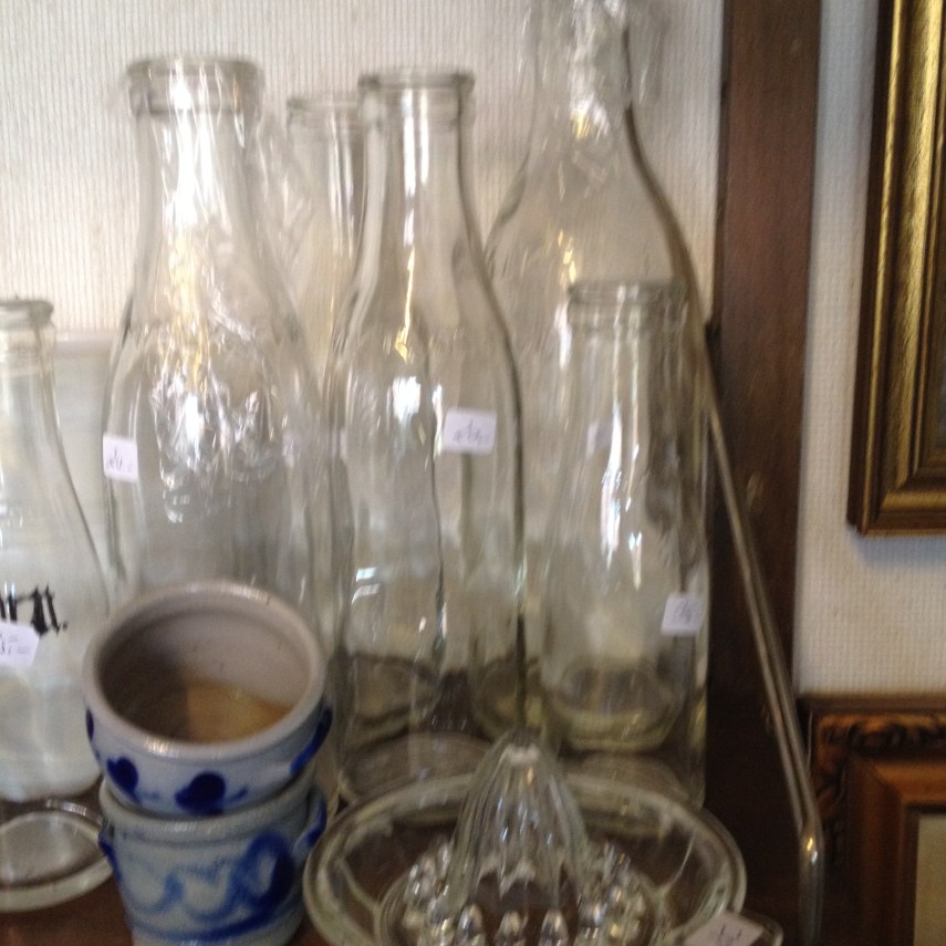 old milk bottles and other kitchen ware