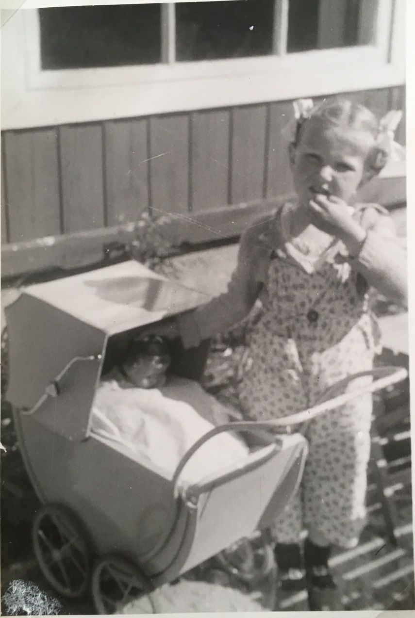 A.M. and her doll pram and composition doll