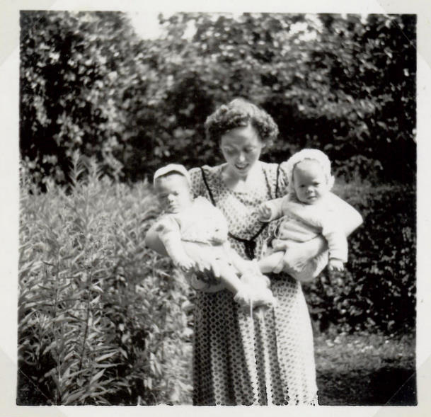 Our mother with us in my grandparents' garden summer 1951