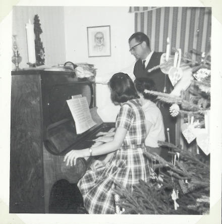 Christmas 1962. Lit candles on the three