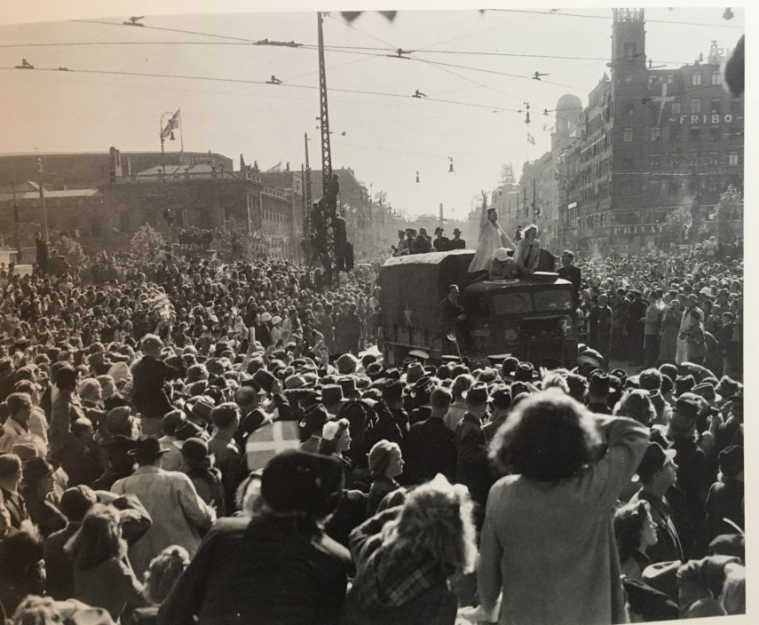 British land troops are greeted at our Town Hall Square in Copenhagen. The tower to the right in the back is the tower where Citroen made his stunt the year before