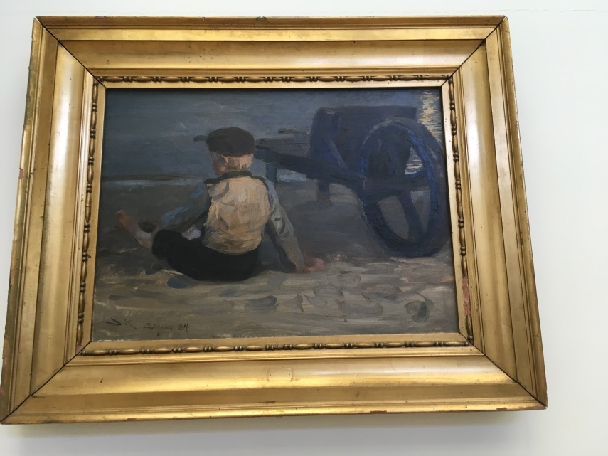 P.S. Kroeyer "A Fisher boy sitting beside a wheelbarrow 1884