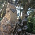 Don Quixote and Sancho Panza kneeling seen from&nbsp;behind