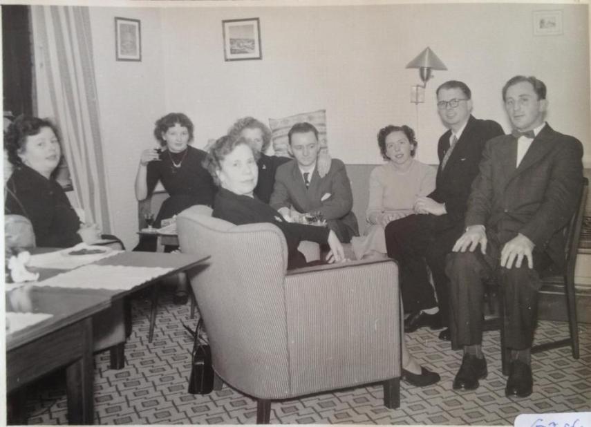 The extended table and the furniture in our parents' home in the early 1950s