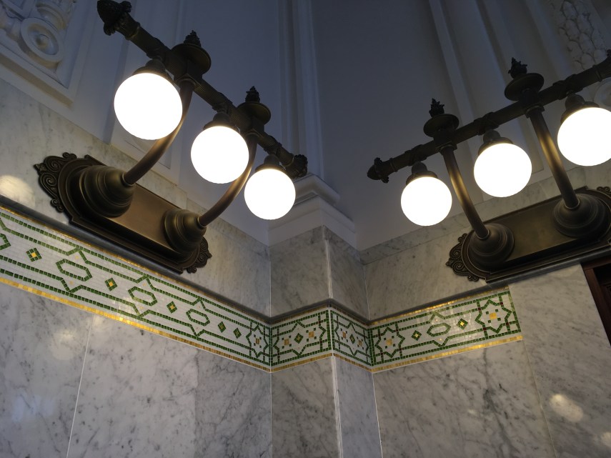 Lamps and the mosaic  decoration underneath at King Street Station