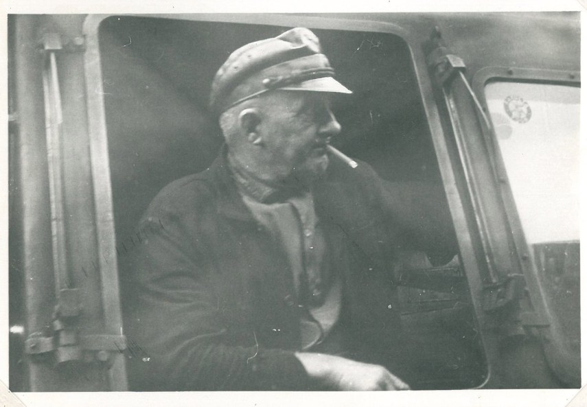 A glimpse of a bypassing train conductor somewhere in former East Germany