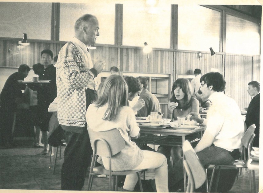 Our teacher is instruction us on something. Some French boys had found our table