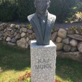 A bronze bust of Kaj Munk in the Vedsersoe&nbsp;Churchyard