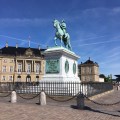 The equestrian statue of a king in front of the Queen’s&nbsp;palace